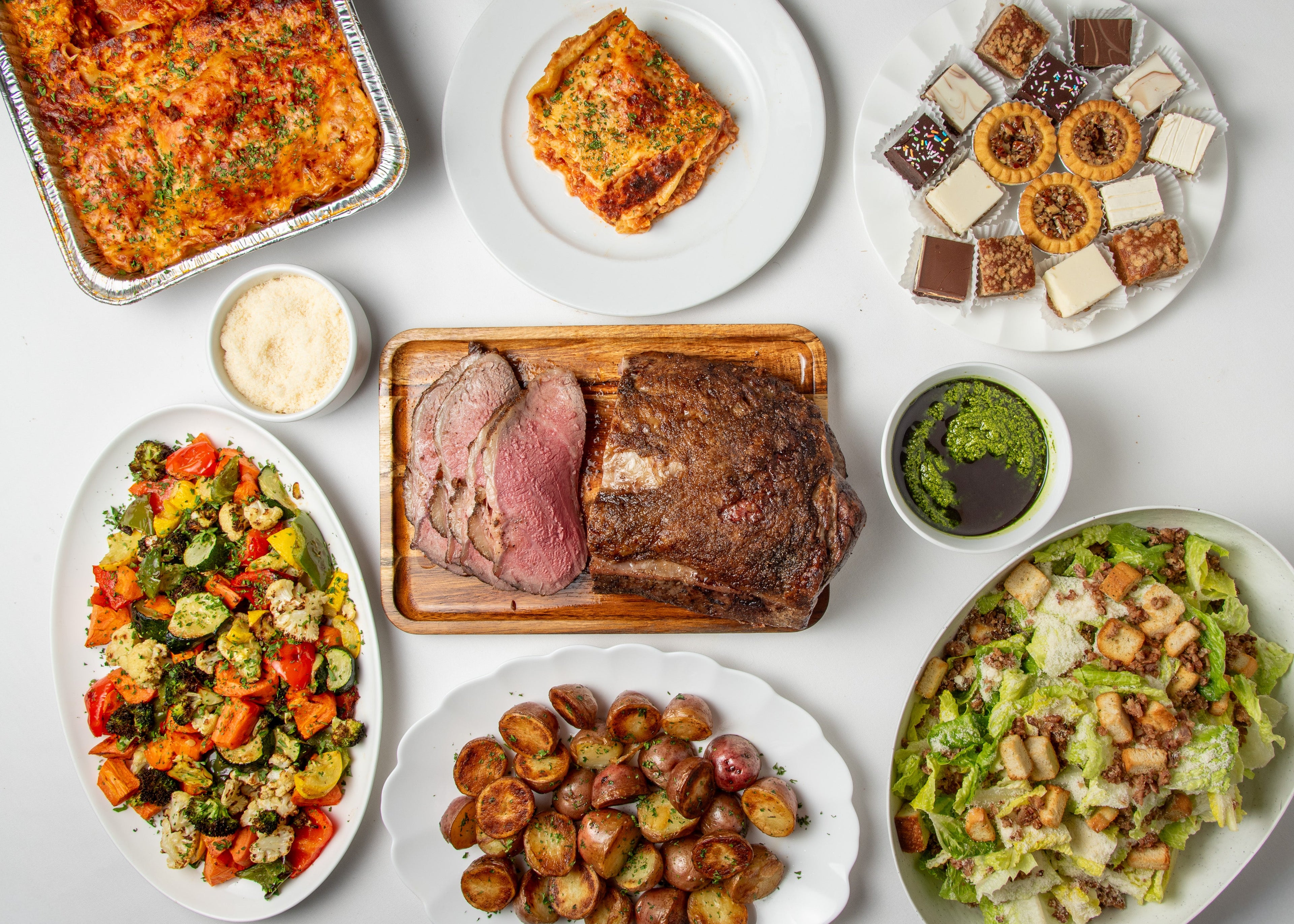 This meal comes with

Caesar Salad
Romaine Lettuce, House Caesar Dressing, Bacon, Parmesan &amp; Croutons&nbsp;

Lasagna al Forno
Bolognese Ragù, Tomato Basil Sauce, Mozzarella, Parmesan&nbsp;

4 oz Grated Parmesan
Add on to pasta

1/2 Slow Roasted Striploin

Chimichurri
Small 500 ml

Vegetable Medley&nbsp;

Roasted Red Potatoes&nbsp;

Assorted Squares &amp; Tarts